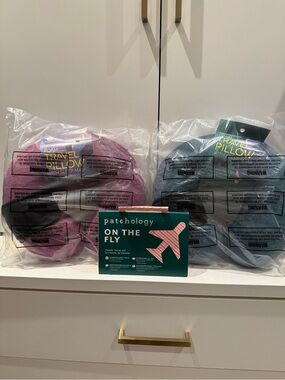 2 Brand New memory foam Travel Pillow Set in Purple and green with eye masks
